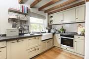 The shaker style kitchen perfectly complements Kear Cottage.