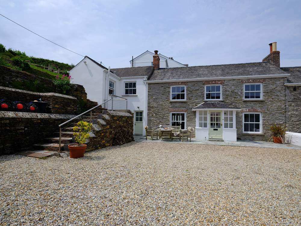 The front of the property showing the gravelled parking-area.