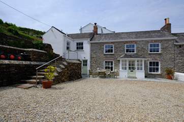 The front of the property showing the gravelled parking area.