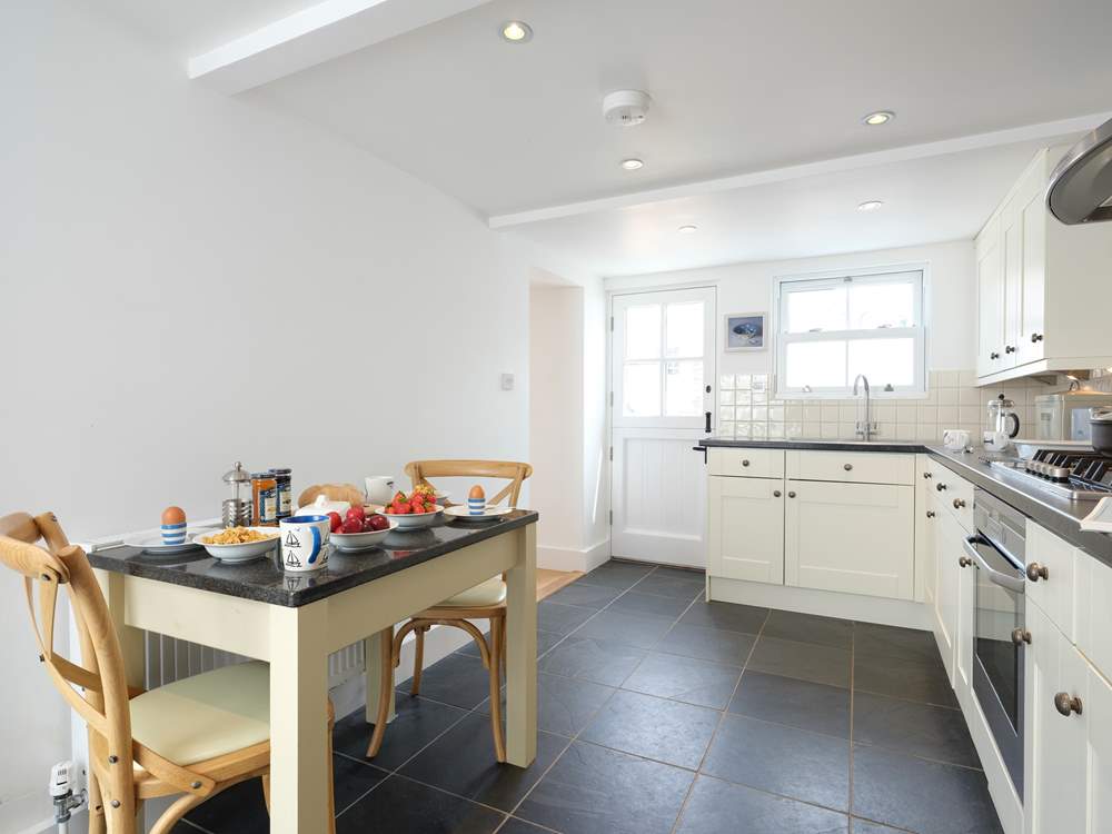 The kitchen with stable-door to the terrace.