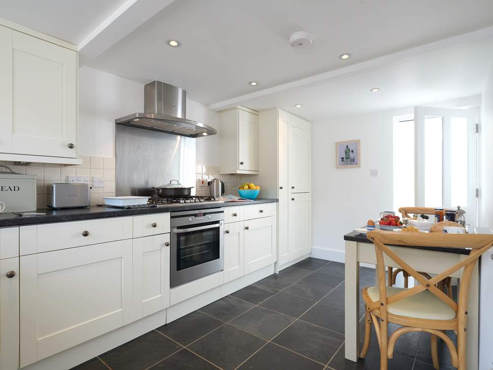 The kitchen looking through to the utility-room.