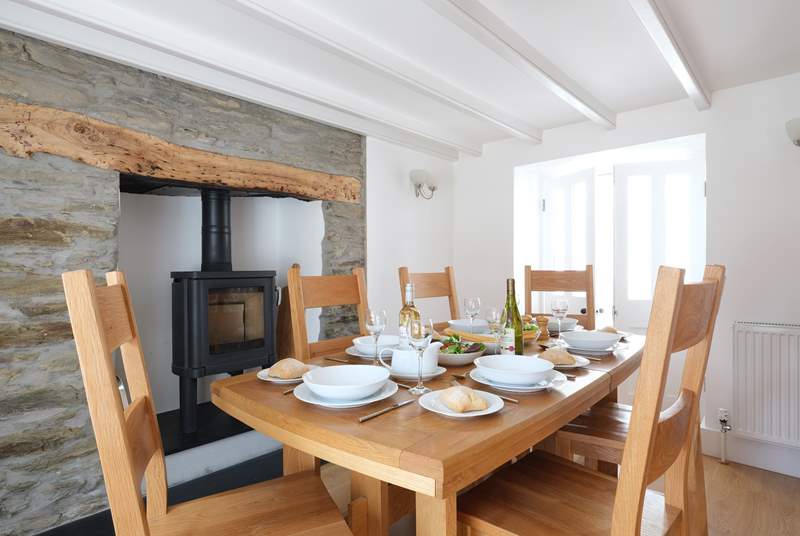 Gather everyone around the table to chat about the days adventures. The wood-burner is decorative only and not for guests use.