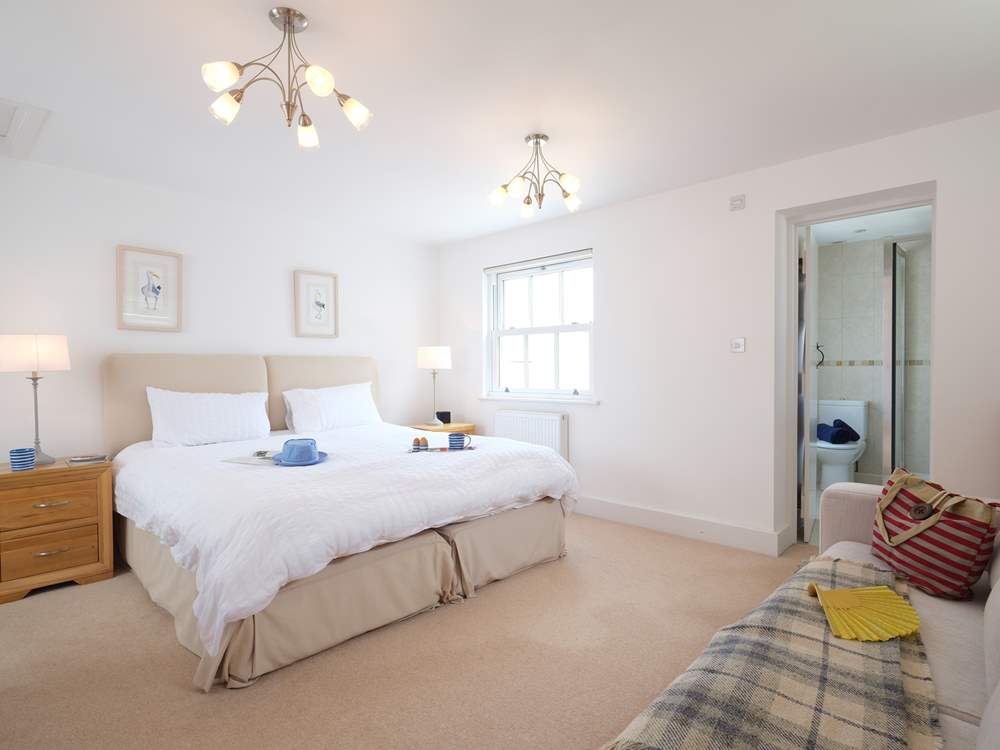 Bedroom 1 has an en suite shower-room.