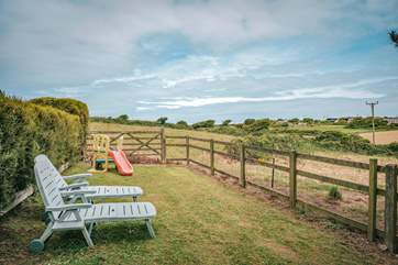 Countryside views surround the cottage.