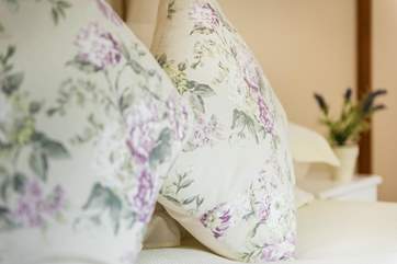 Pretty florals and white linens throughout.