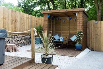 The rear terrace with hot tub.