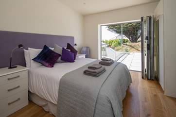 Bedroom 3 is extremely pretty and is rather special as it opens up alongside the pool. Roll out of bed and straight into your swimwear.