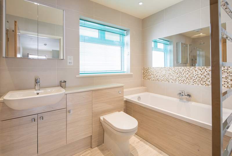 The spacious and family-friendly bathroom is perfect for washing away the daily build-up of sand and sun cream.