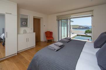 Bedroom 2 offers extra sleeping flexibility as can be configured as a king-sized double, or 2 single beds. This lovely room opens out onto the rear of the house, enjoying views out to sea.