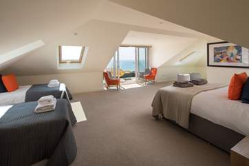 The first floor houses this fabulous family room, sleeping four. Home to two single beds and a king-size double bed, this spacious room is perfect for spreading out and making yourself at home.
