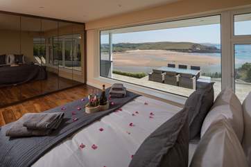 The master bedroom is stunning with its sumptuous king-sized bed.