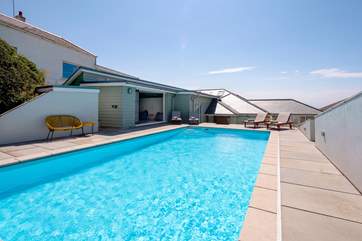 The outdoor heated pool is so inviting and will prove a huge hit with the whole family.