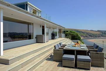 This stunning house stands proudly overlooking the beach and sea.