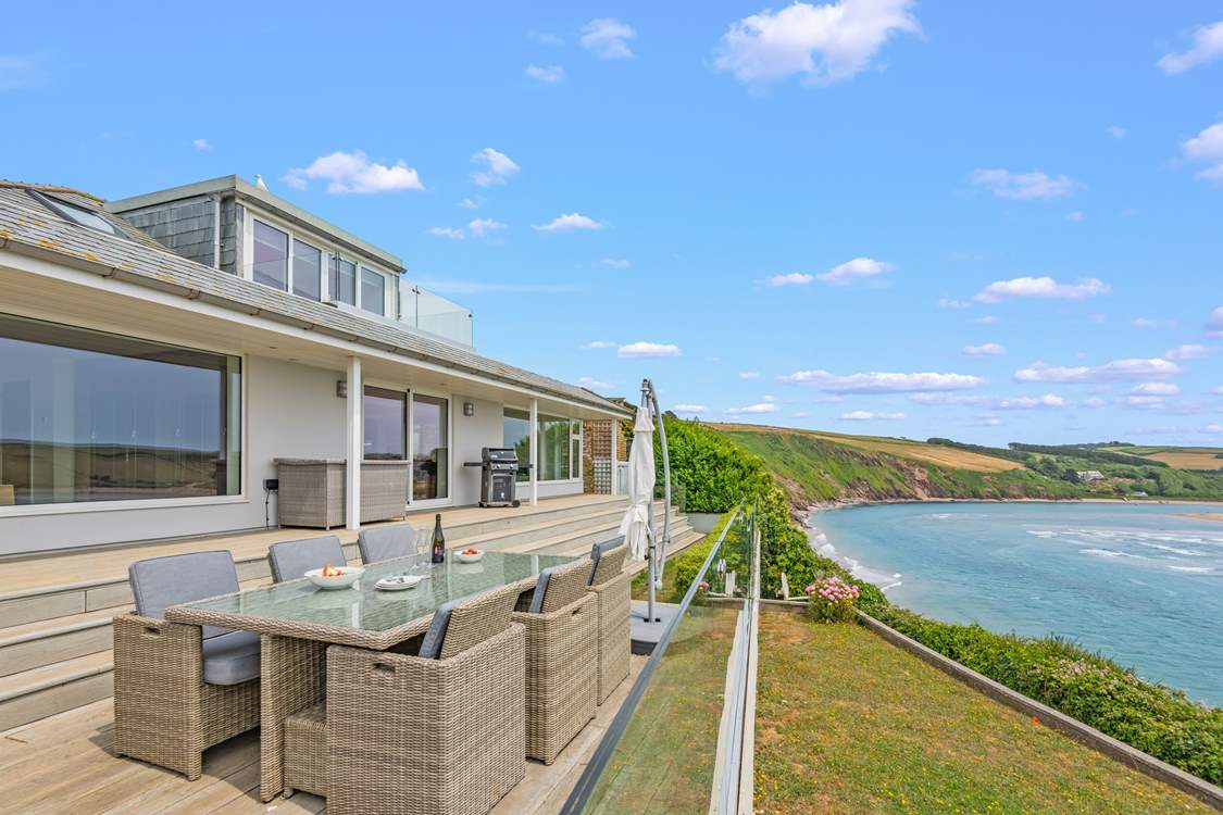 This stunning house stands proudly overlooking the beach and sea.