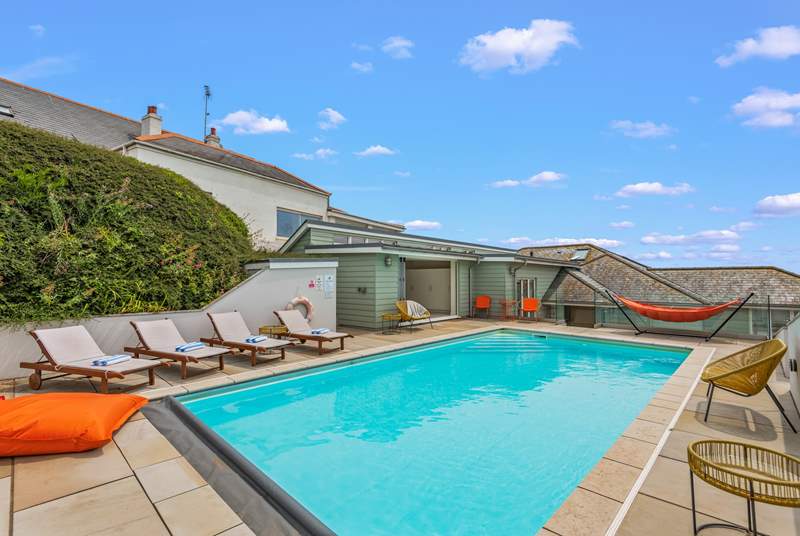 The outdoor heated pool is so inviting and will prove a huge hit with the whole family.