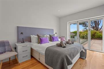 Bedroom 3 is extremely pretty and is rather special as it opens up alongside the pool. Roll out of bed and straight into your swimwear.