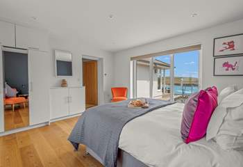 Bedroom 2 offers extra sleeping flexibility as can be configured as a king-sized double, or 2 single beds. This lovely room opens out onto the rear of the house, enjoying views out to sea.