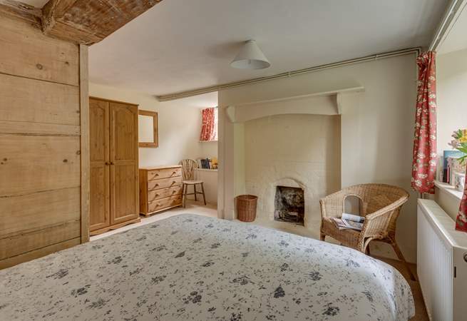 Another view of the ground floor bedroom with its  ornamental feature fireplace.