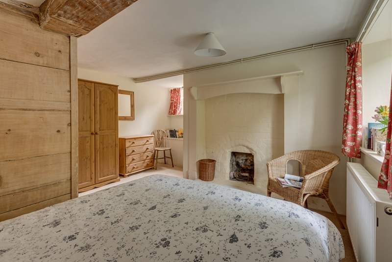 Another view of the ground floor bedroom with its  ornamental feature fireplace.