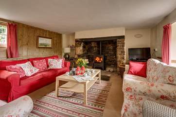 There is a traditional inglenook fireplace and wood-burning stove at the heart of this lovely quirky historic house.