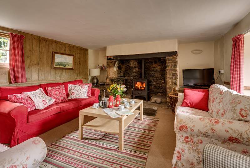There is a traditional inglenook fireplace and wood-burning stove at the heart of this lovely quirky historic house.