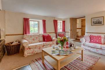 The sitting-room is very spacious, just a couple of steps down from the hallway.