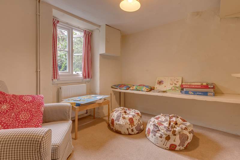 There is a snug off the hallway too - an ideal hideaway for children to spread out their toys or play games.