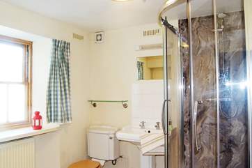 There is a shower in the downstairs bathroom and a bath upstairs.