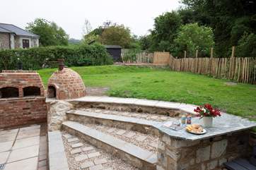 The outside space has a patio and garden area