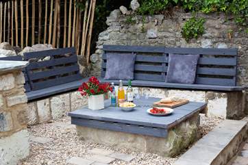 This seating area is perfect for al fresco dining during the long summer days