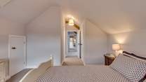 The two bedrooms are at opposite ends of the corridor.