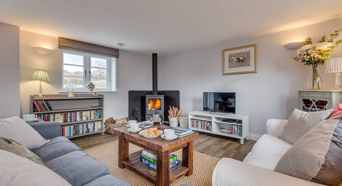 The sitting-room has a wood-burning stove and deep comfy sofas to curl up on.