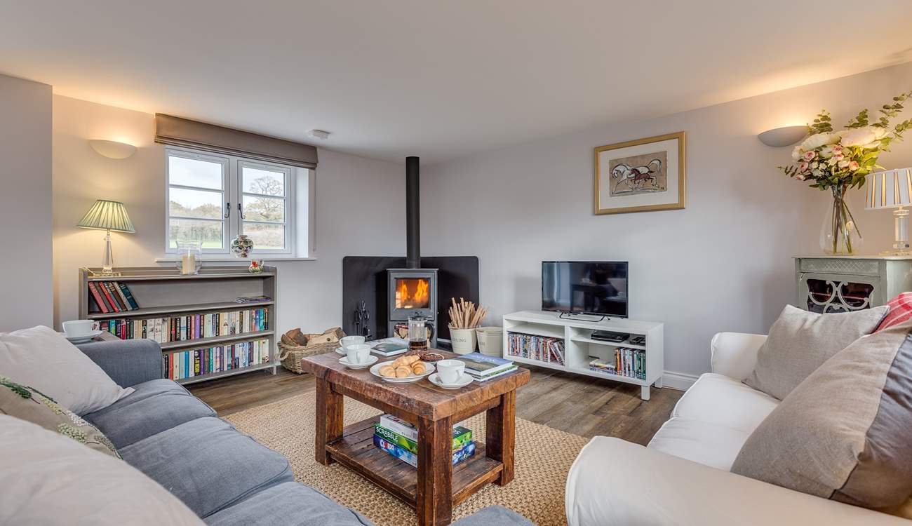 The sitting-room has a wood-burning stove and deep comfy sofas to curl up on.