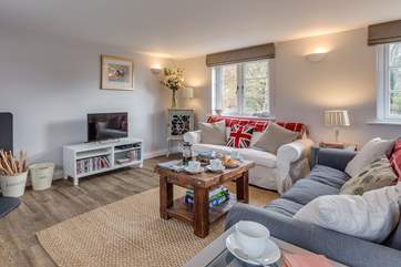 Another view of the sitting-room. This is a sunny dual-aspect room but so cosy for a restful stay at any time of the year.