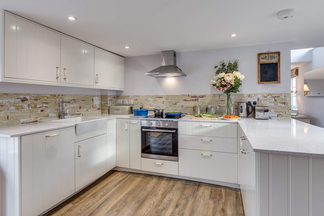 The kitchen is a delightful sociable space to cook in, with the farmhouse table in the other half of the room.