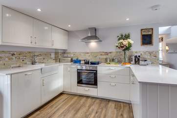 The kitchen is a delightful sociable space to cook in, with the farmhouse table in the other half of the room.