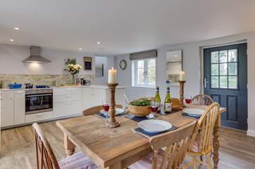 The kitchen/dining-room is really spacious, with the front door opening to the farmstead.