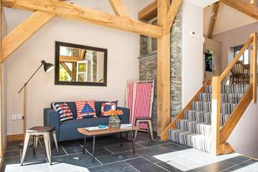 Steps lead up to the open plan living area and down to the bedrooms from the entrance area.