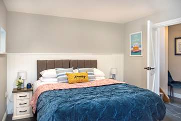 Bedroom one has a comfy super-king (or twin) bed, beautifully dressed with a gorgeous bedspread and cushions.