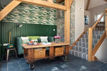 Steps lead up to the open plan living-area and down to the bedrooms from the entrance area.