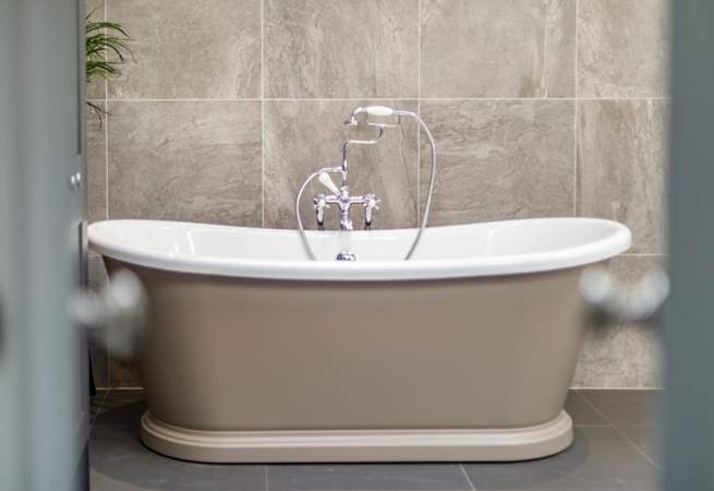 Treat yourself to a leisurely soak in the gorgeous free-standing bath.
