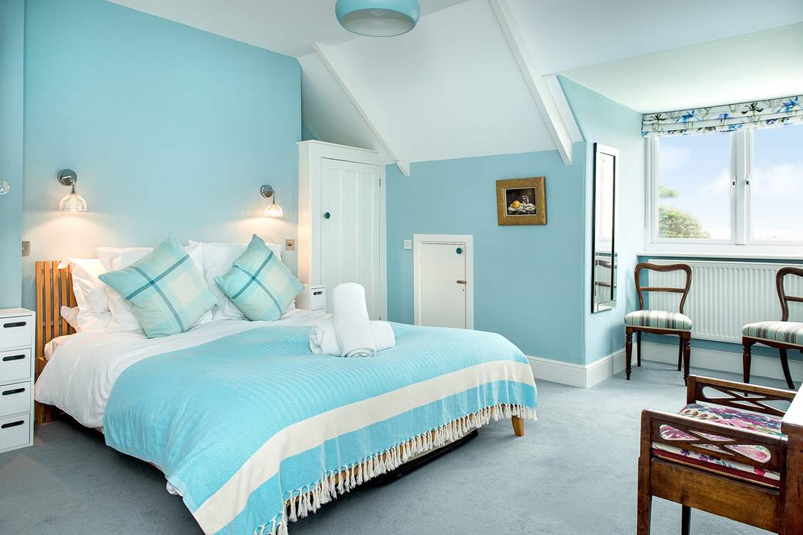 Bedroom 2 sits at the front of the house and enjoys sea views.