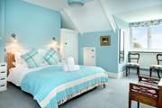 Bedroom 2 sits at the front of the house and enjoys sea views.