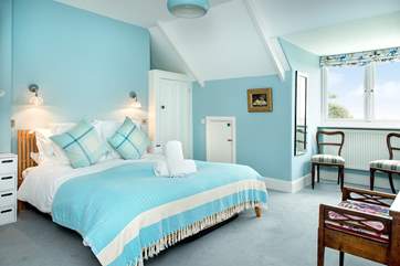 Bedroom 2 sits at the front of the house and enjoys sea views.