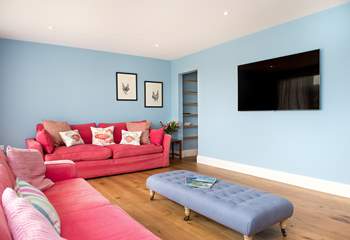 The sitting-room boasts a 62 inch TV so why not enjoy a holiday movie or two!
