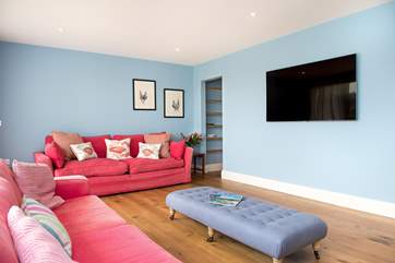 The sitting-room boasts a 62 inch TV so why not enjoy a holiday movie or two!