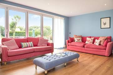 The bi-fold doors from the sitting-room open up to the garden.