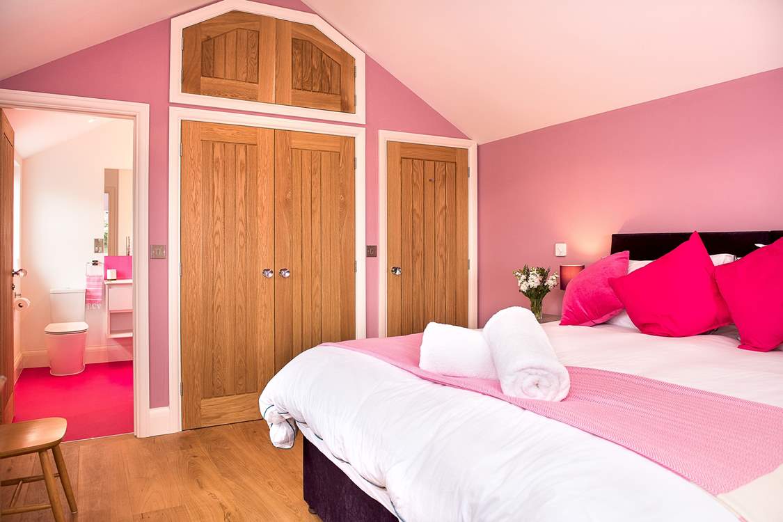 To match the bedroom the pink theme carries on in the stylish shower-room.