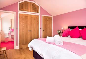 To match the bedroom the pink theme carries on in the stylish shower-room.