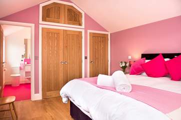 To match the bedroom the pink theme carries on in the stylish shower-room.